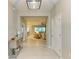 Inviting foyer with tile flooring, showcasing views into the living area and dining space at 15612 Trinity Fall Way, Bradenton, FL 34212