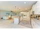 Bright, open kitchen features a granite island, stainless appliances and leads into a cozy living room at 15612 Trinity Fall Way, Bradenton, FL 34212
