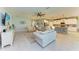 Bright open living room with access to the kitchen featuring lots of natural light at 15612 Trinity Fall Way, Bradenton, FL 34212