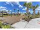 A fun playground offers swings, a rock-climbing structure, and palm trees providing shade for endless outdoor enjoyment at 15612 Trinity Fall Way, Bradenton, FL 34212