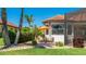 Outdoor patio with seating and lush landscaping, creating a private and inviting backyard space at 20114 Uffizi Ct, Venice, FL 34293
