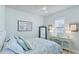 Bright bedroom featuring stylish decor, ample natural light, and a calm aesthetic at 20114 Uffizi Ct, Venice, FL 34293