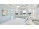 Serene bedroom featuring light blue walls, natural light, and decorative accents at 20114 Uffizi Ct, Venice, FL 34293