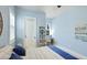Bright bedroom featuring a ceiling fan, coastal decor art piece, and desk nook at 20114 Uffizi Ct, Venice, FL 34293