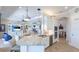 Open concept kitchen with stainless steel appliances and sleek, modern design at 20114 Uffizi Ct, Venice, FL 34293