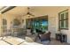 Lanai featuring outdoor bar seating, outdoor lounge furniture, and a view of the pool at 20114 Uffizi Ct, Venice, FL 34293