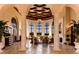Expansive lobby with soaring ceilings, elegant columns, and ample seating at 20114 Uffizi Ct, Venice, FL 34293