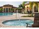 Resort-style pool area featuring a relaxing hot tub, comfortable lounge chairs, and well-manicured landscaping at 20114 Uffizi Ct, Venice, FL 34293