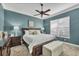 Bedroom featuring a large bed, ceiling fan, and bedside tables with lamps at 2020 Calusa Lakes Blvd, Nokomis, FL 34275