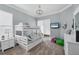Bedroom showcasing a bunk bed, television, and a bright, airy ambiance at 2020 Calusa Lakes Blvd, Nokomis, FL 34275