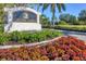 Calusa Lakes community entrance sign with a beautiful waterfall in the background and colorful landscaping at 2020 Calusa Lakes Blvd, Nokomis, FL 34275