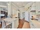Well-lit kitchen with a center island, stainless steel appliances, and hardwood floors at 2020 Calusa Lakes Blvd, Nokomis, FL 34275