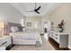 Comfortable main bedroom with white shiplap accent wall and hardwood floors at 2020 Calusa Lakes Blvd, Nokomis, FL 34275