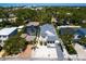 Spacious property with a pool, screened enclosure, manicured landscaping, and a multi-car driveway at 2159 Hawthorne St, Sarasota, FL 34239