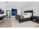 Modern main bedroom featuring a large bed, contemporary artwork, and elegant furnishings at 2159 Hawthorne St, Sarasota, FL 34239