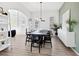 Modern dining room with plank floors, bright light, and neutral decor at 2159 Hawthorne St, Sarasota, FL 34239