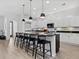 Bright, open kitchen boasts a large island with seating and modern stainless steel appliances at 2159 Hawthorne St, Sarasota, FL 34239