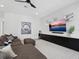 Inviting living room boasts a stylish sectional sofa and a sleek entertainment console at 2159 Hawthorne St, Sarasota, FL 34239