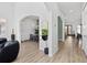 Open-concept living space with lots of light, arches, and plank flooring at 2159 Hawthorne St, Sarasota, FL 34239