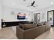 Comfortable living room features a modern entertainment center and plush sectional sofa at 2159 Hawthorne St, Sarasota, FL 34239