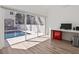 Office with views of the pool, with hardwood floors, a modern desk, and large windows at 2159 Hawthorne St, Sarasota, FL 34239