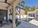 Beautiful backyard featuring a swimming pool, covered patio, and lush landscaping at 2159 Hawthorne St, Sarasota, FL 34239