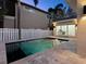 Pool area at night, showing the privacy fence, connecting office space, and backyard layout at 2159 Hawthorne St, Sarasota, FL 34239