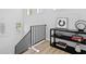 Modern staircase with black railing and decorative accents on display shelf by landing window at 2159 Hawthorne St, Sarasota, FL 34239