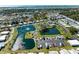 Wonderful aerial view showcasing the neighborhood amenities, lakes, and surrounding greenery at 216 Palm Air Dr, Osprey, FL 34229