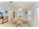 Cozy dining area with built-in storage and a glass table with seating for four at 216 Palm Air Dr, Osprey, FL 34229