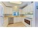 Clean kitchen with white cabinets, and stainless steel appliances at 216 Palm Air Dr, Osprey, FL 34229