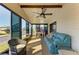 Enclosed lanai provides additional seating and dining space, perfect for enjoying views of the community at 216 Palm Air Dr, Osprey, FL 34229