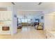 Open-concept living room with light-colored walls, wood-look flooring, and comfortable furniture at 216 Palm Air Dr, Osprey, FL 34229