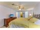 Comfortable primary bedroom features carpet floors, a ceiling fan, and an attached bathroom at 216 Palm Air Dr, Osprey, FL 34229