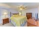 Relaxing primary bedroom boasts carpet floors, a ceiling fan, ample storage, and natural light at 216 Palm Air Dr, Osprey, FL 34229
