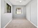 Bedroom featuring neutral paint, carpeted floors, a window, and a closet at 218 80Th N Ave, St Petersburg, FL 33702