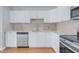 Updated kitchen featuring stainless steel appliances, granite countertops, and ample cabinet space at 218 80Th N Ave, St Petersburg, FL 33702