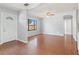 Inviting living room with hardwood floors, ceiling fan, and ample natural light at 218 80Th N Ave, St Petersburg, FL 33702