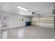 Epoxy floor garage with door to exterior at 2242 Sunnyside Ln, Sarasota, FL 34239