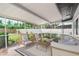 Cozy screened lanai with a seating area and outdoor view at 2242 Sunnyside Ln, Sarasota, FL 34239