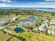Aerial view of community near golf course, ponds, and other residential buildings, showcasing a well-planned community at 2320 Terra Ceia Bay Blvd # 305, Palmetto, FL 34221