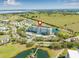 Aerial view showcasing the condo's prime location, surrounded by lush greenery, water features, and community amenities at 2320 Terra Ceia Bay Blvd # 305, Palmetto, FL 34221