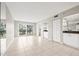 Open-concept living room with tile flooring, slider doors to balcony, and convenient wet bar area at 2320 Terra Ceia Bay Blvd # 305, Palmetto, FL 34221