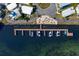 Aerial shot of a community marina featuring boat docks and a relaxing fire pit area at 2601 Gulf N Dr # B24, Bradenton Beach, FL 34217