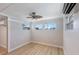 Bright bedroom with ample natural light, a ceiling fan, and an AC unit for comfort at 2601 Gulf N Dr # B24, Bradenton Beach, FL 34217