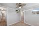 Comfortable bedroom featuring sleek floors, a ceiling fan, and a mounted TV at 2601 Gulf N Dr # B24, Bradenton Beach, FL 34217