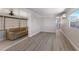 Spacious living room features modern flooring and seamless flow to sunroom at 2601 Gulf N Dr # B24, Bradenton Beach, FL 34217