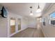 Expansive living area boasts stylish lighting and easy access to the enclosed porch at 2601 Gulf N Dr # B24, Bradenton Beach, FL 34217