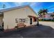 Charming office building exterior with a quaint awning and inviting bench seating near the entrance at 2601 Gulf N Dr # B24, Bradenton Beach, FL 34217