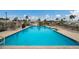 Community swimming pool offering ample space and lounge chairs for relaxing by the water at 2601 Gulf N Dr # B24, Bradenton Beach, FL 34217